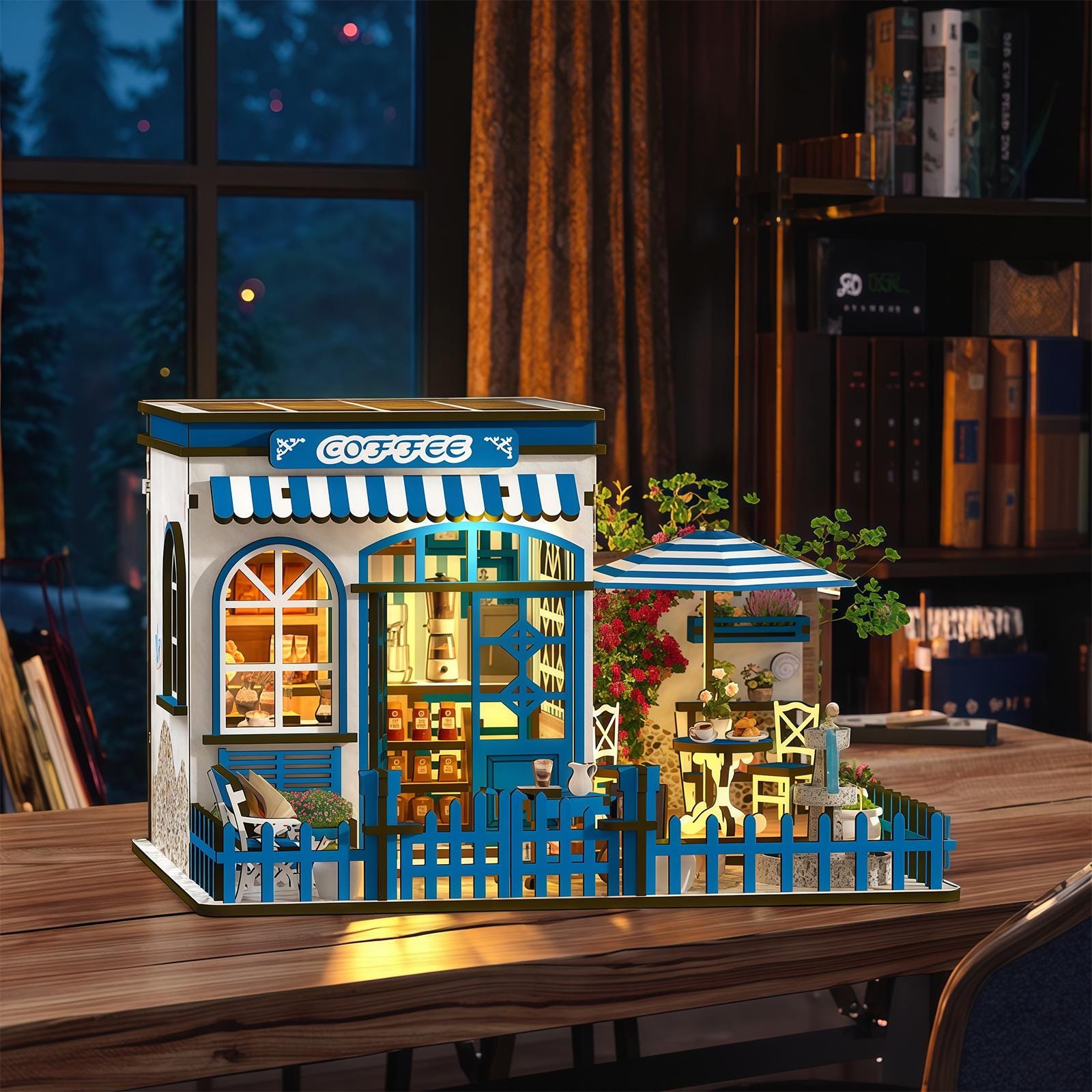 May include: A miniature coffee shop model with a blue and white color scheme. The model features a sign that says "COFFEE", a striped awning, and a small outdoor seating area with a blue and white umbrella. The model is on a wooden table.