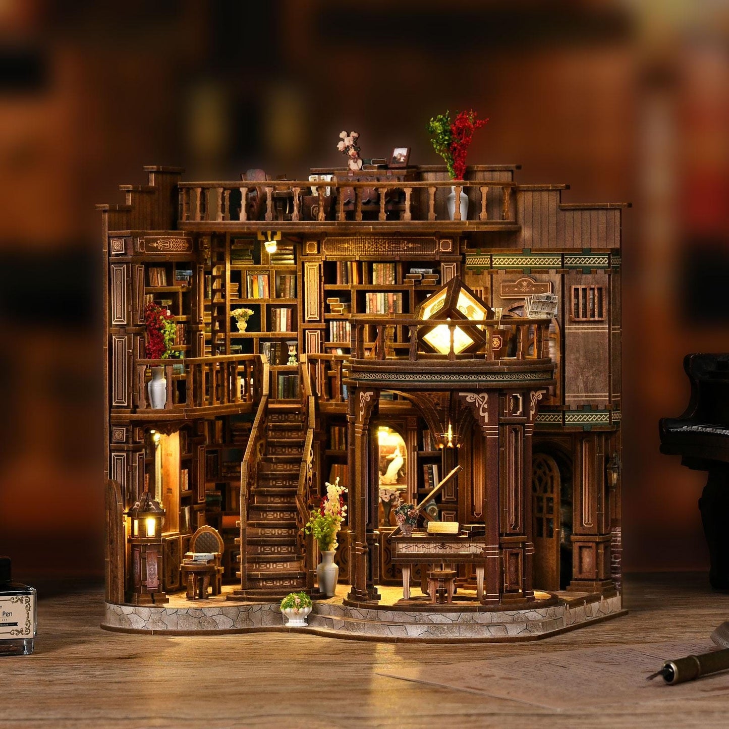 May include: A detailed wooden miniature library with multiple levels, bookshelves, and a staircase. The model features warm lighting, decorative vases, and a small piano. The overall design is intricate, with a focus on architectural detail and a cozy atmosphere.