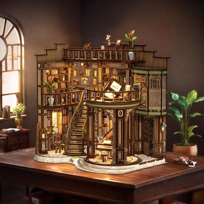 May include: A detailed wooden miniature library model with multiple levels, bookshelves, and a spiral staircase. The model features intricate architectural details, small decorative items, and warm interior lighting, creating a cozy and inviting atmosphere. The model sits on a wooden table.