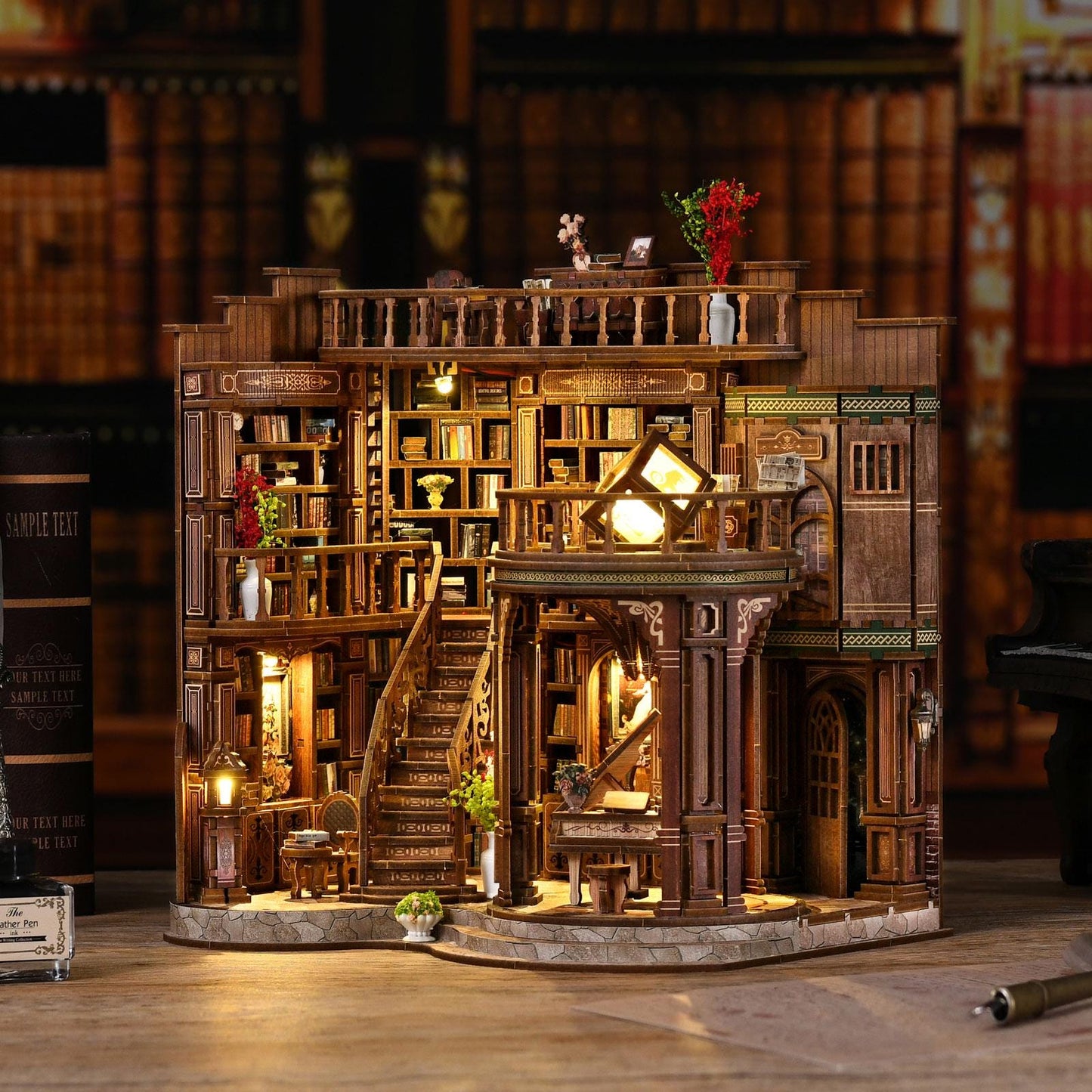 May include: A detailed wooden miniature library model with multiple levels, stairs, and bookshelves. The model features warm lighting, decorative elements, and miniature furniture. The overall color scheme is brown with touches of green and red.