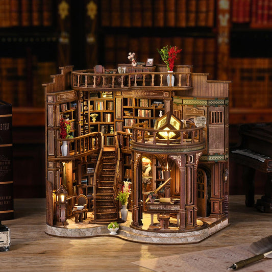 May include: A detailed wooden miniature library with multiple levels, stairs, and balconies. The model features intricate bookshelves filled with tiny books, decorative lighting, and miniature furniture. The overall color scheme is warm brown with accents of green and red.