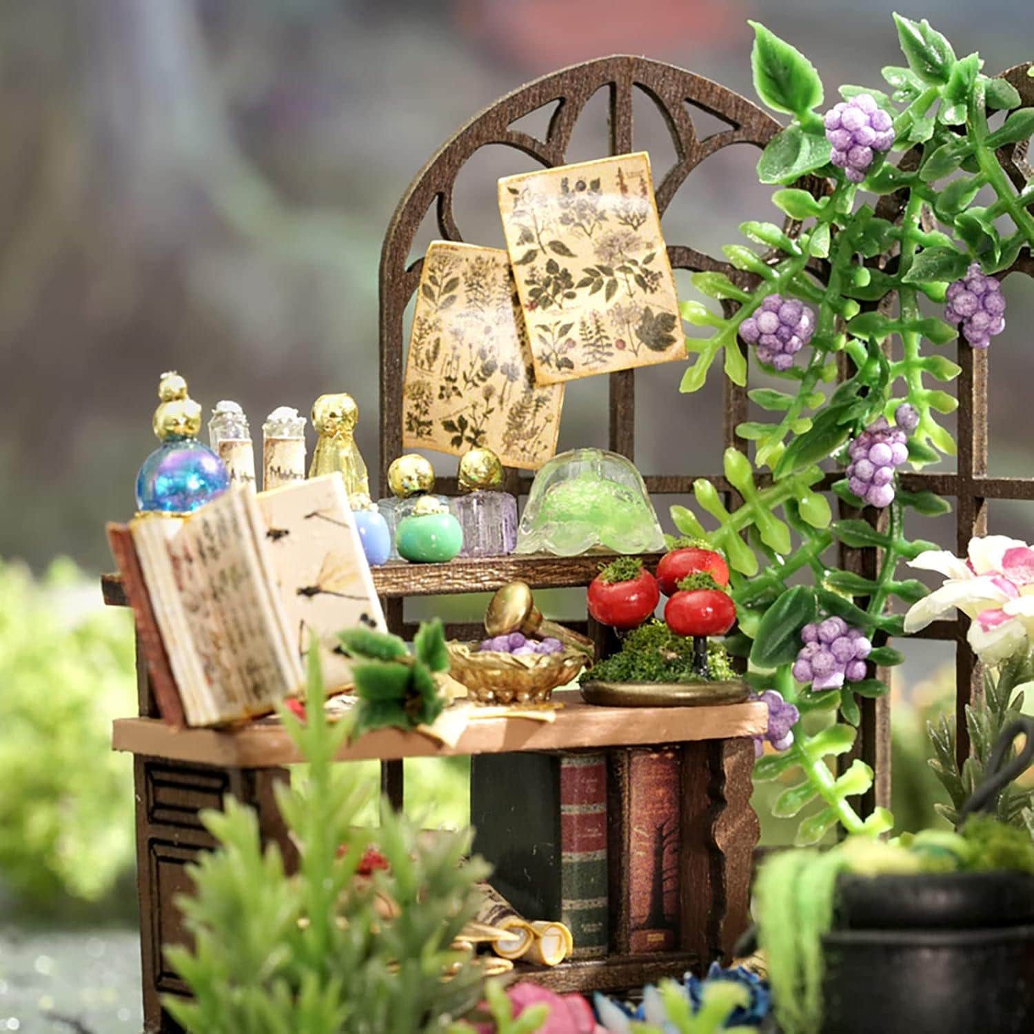 May include: Miniature wooden shelf with books, bottles, and decorative items. The shelf features a small open book, glass bottles, and a decorative bowl. A climbing vine with purple berries and green leaves adorns the window frame, creating a whimsical scene.