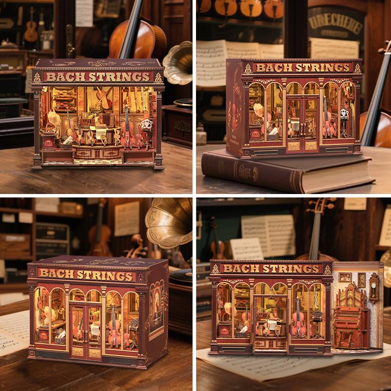 May include: A detailed, miniature model of a shop called "Bach Strings" with a vintage aesthetic. The model features a detailed interior with musical instruments and is illuminated. The shop's facade is a deep red-brown with gold accents.