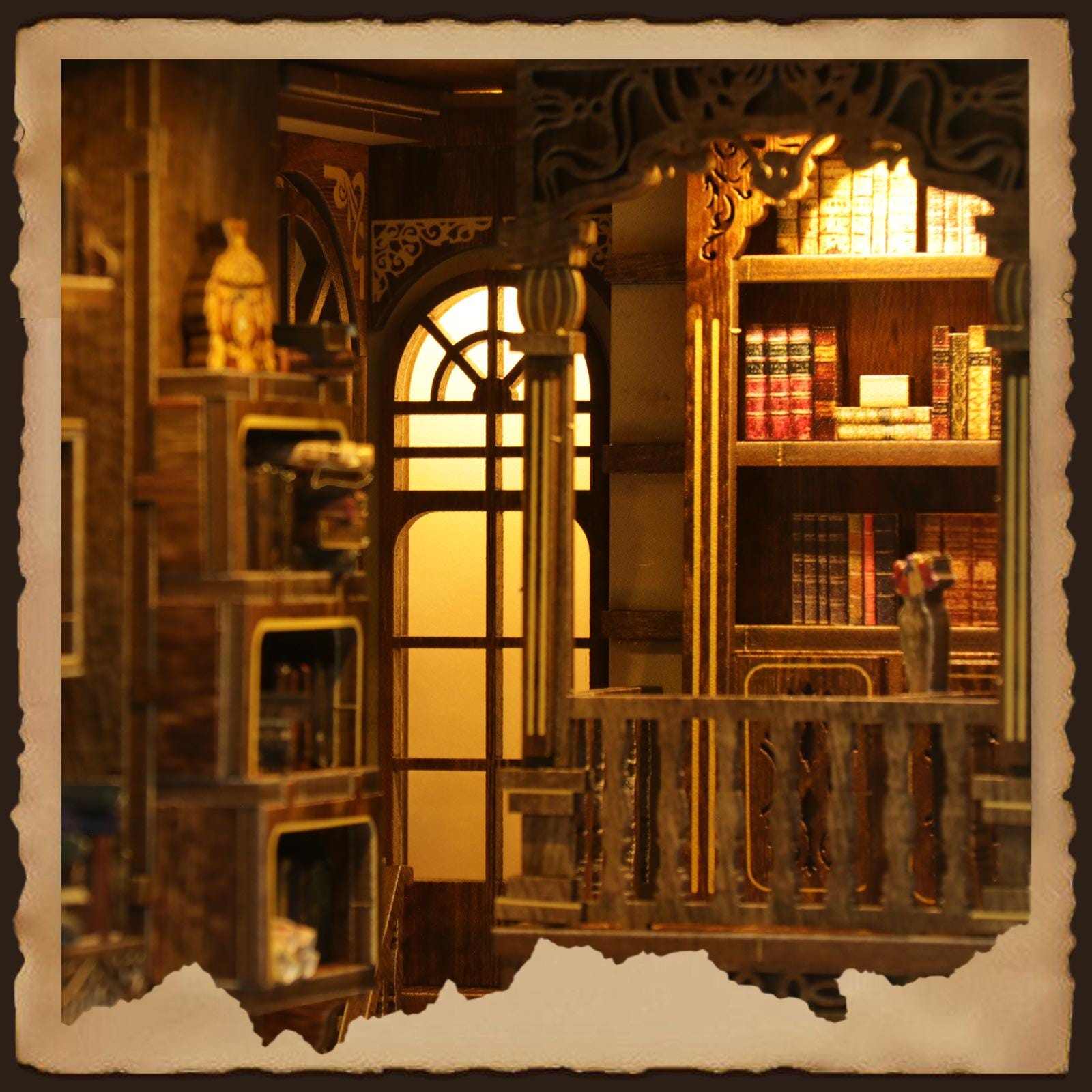 May include: A detailed miniature wooden library scene with a warm, inviting glow. The scene includes bookshelves filled with books, a decorative archway, and a window. A small statue sits on a shelf. The overall colour palette is warm browns and yellows.